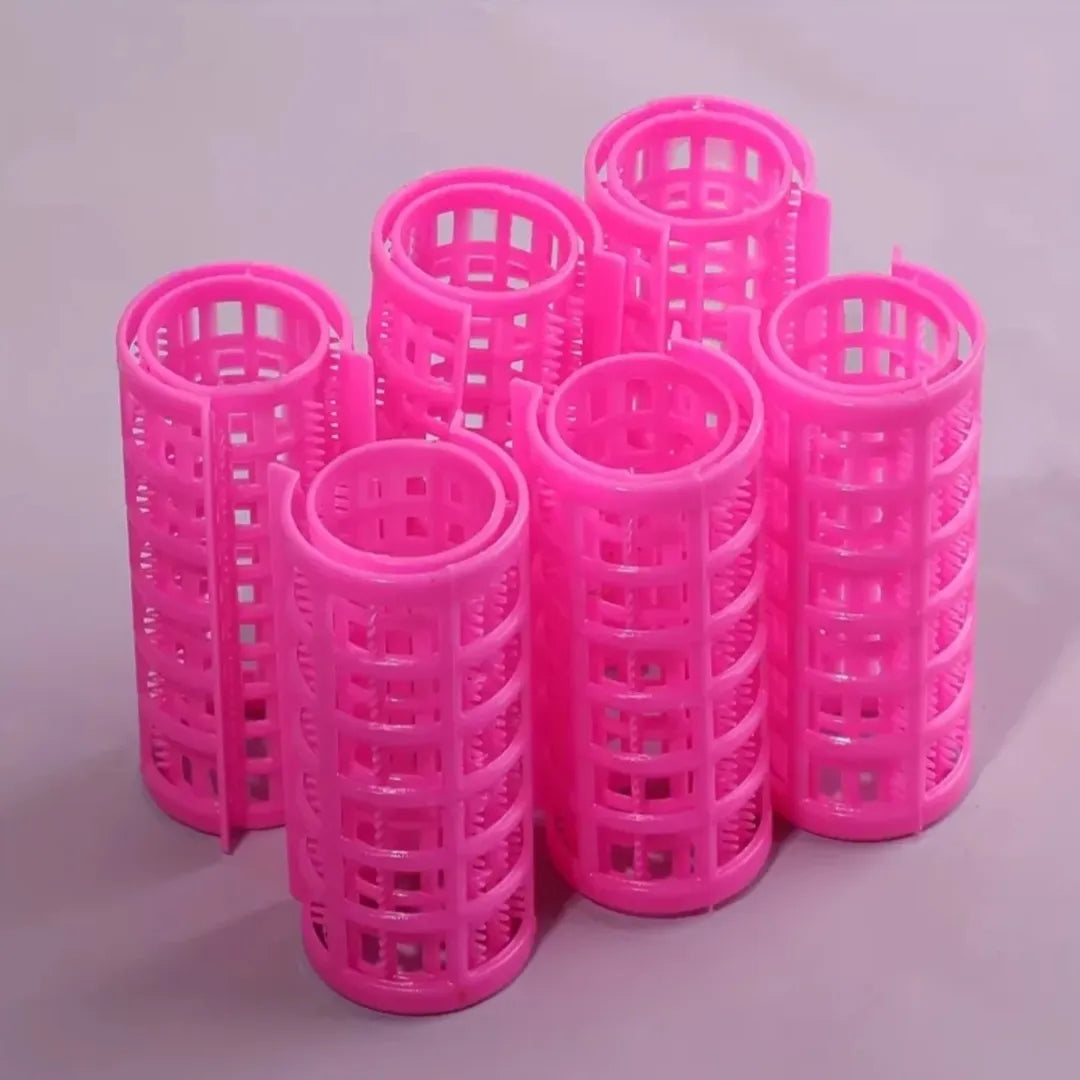 Twelve pink mesh hair rollers stacked together
