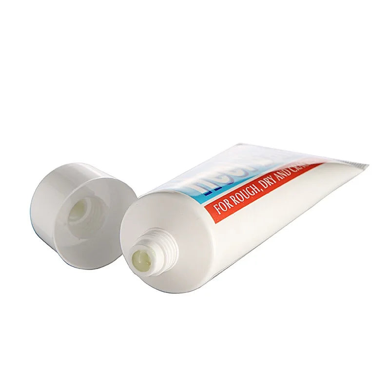 The heel balm tube lying down with its cap off
