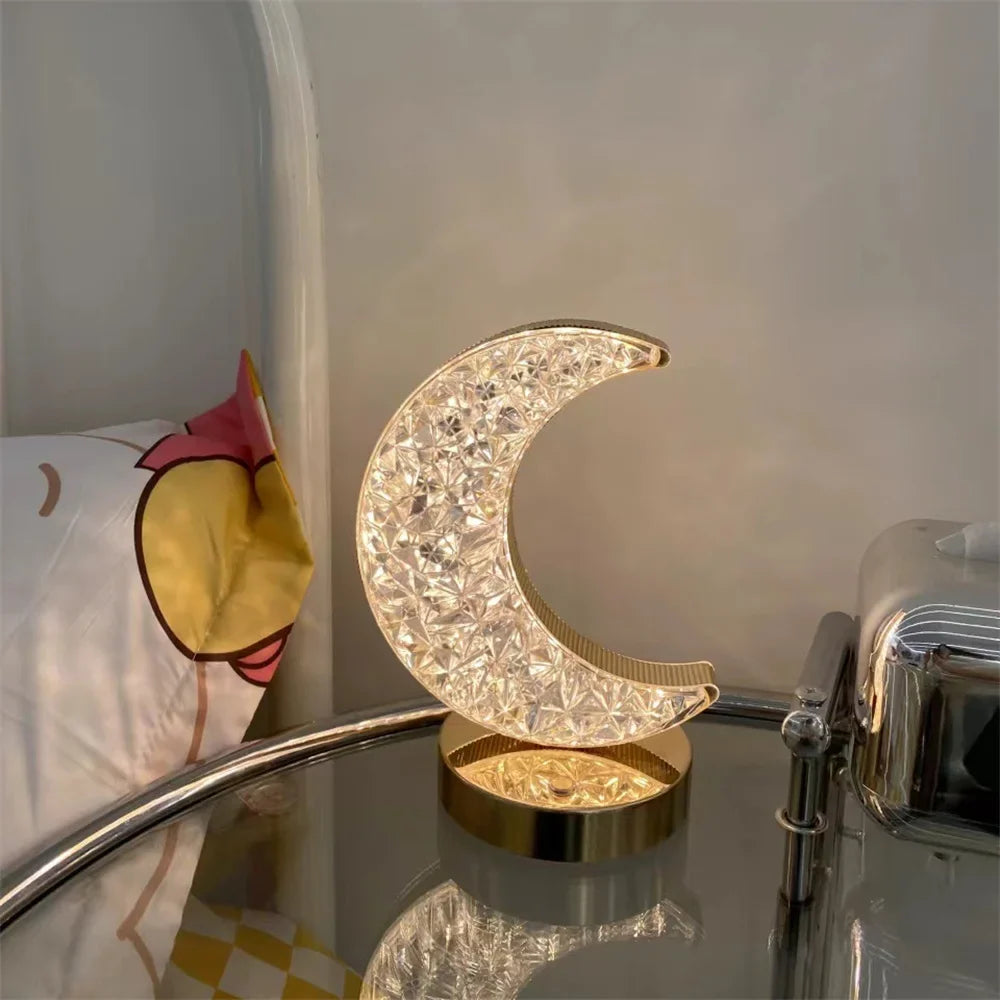 The crystal moon lamp on a glass side table