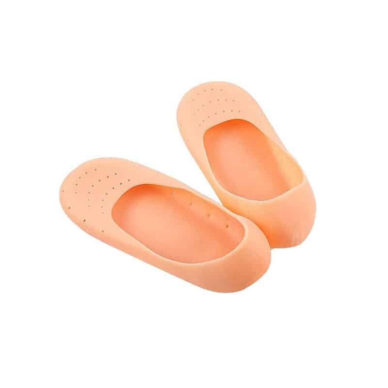A pair of skin-coloured silicone moisturising socks