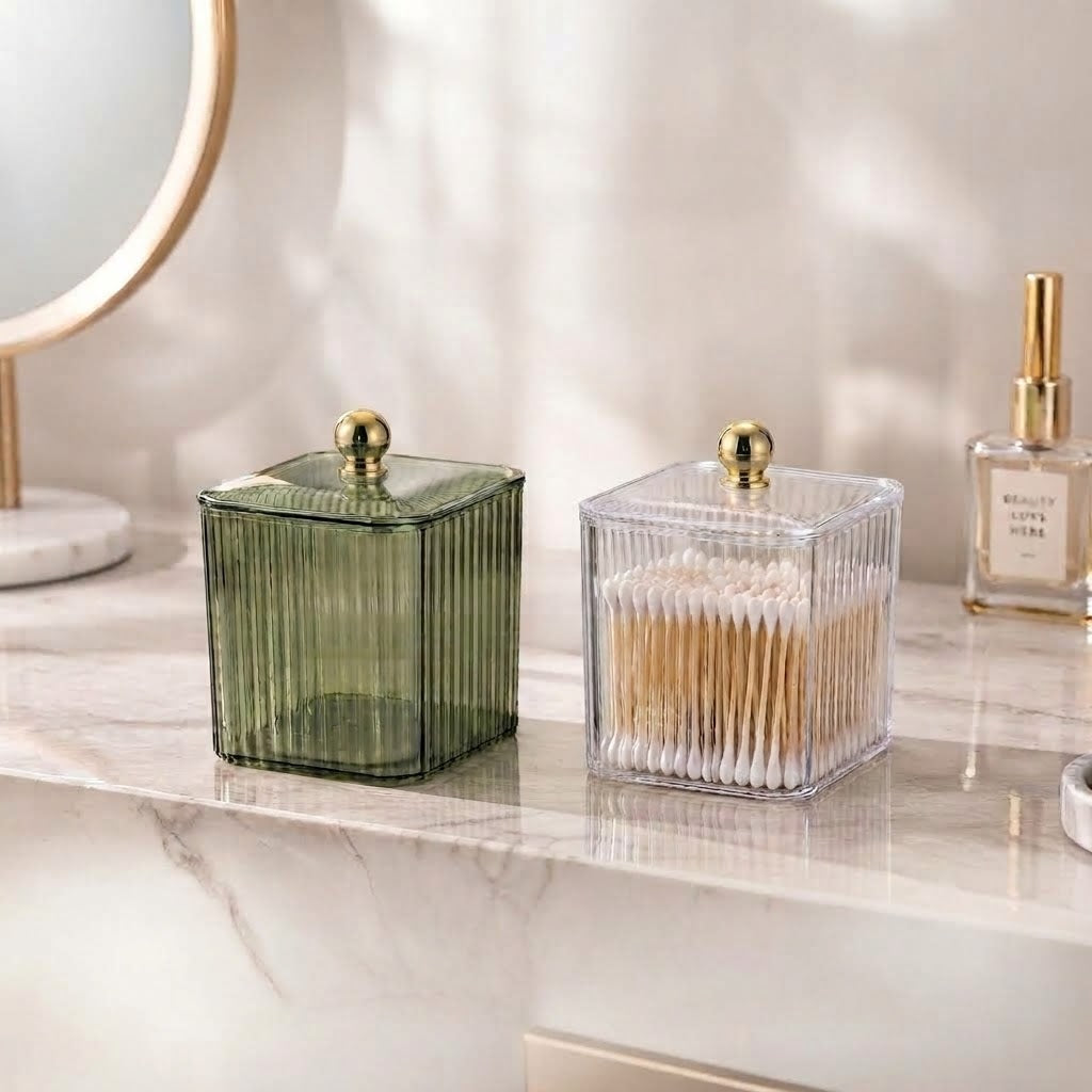 Clear ribbed storage jars with lids, holding cotton buds