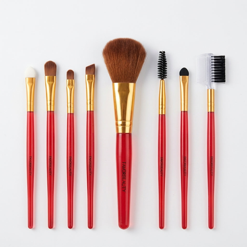 Eight travel makeup brushes with red handles and gold ferrules