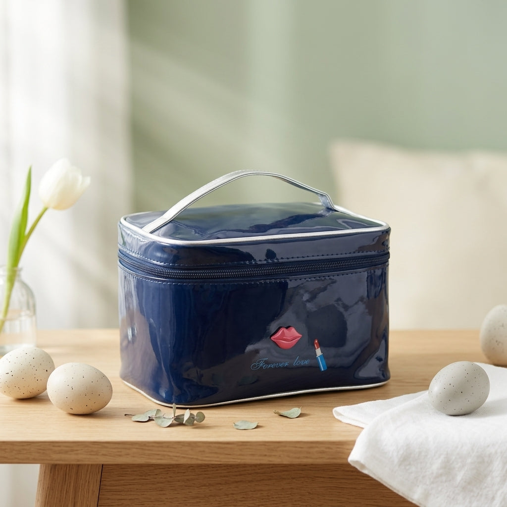 The navy toiletry bag on a wooden shelf beside a white tulip