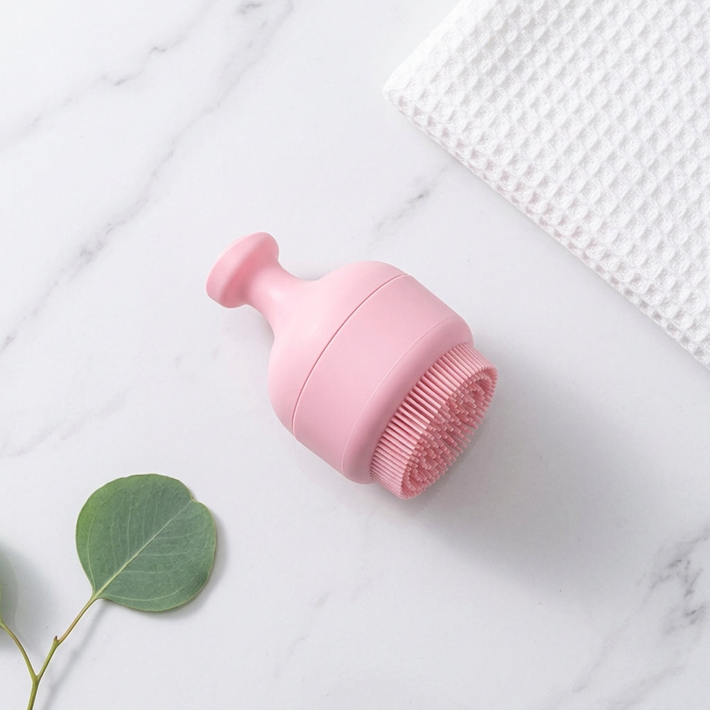 The pink ice face roller lying on a marble surface