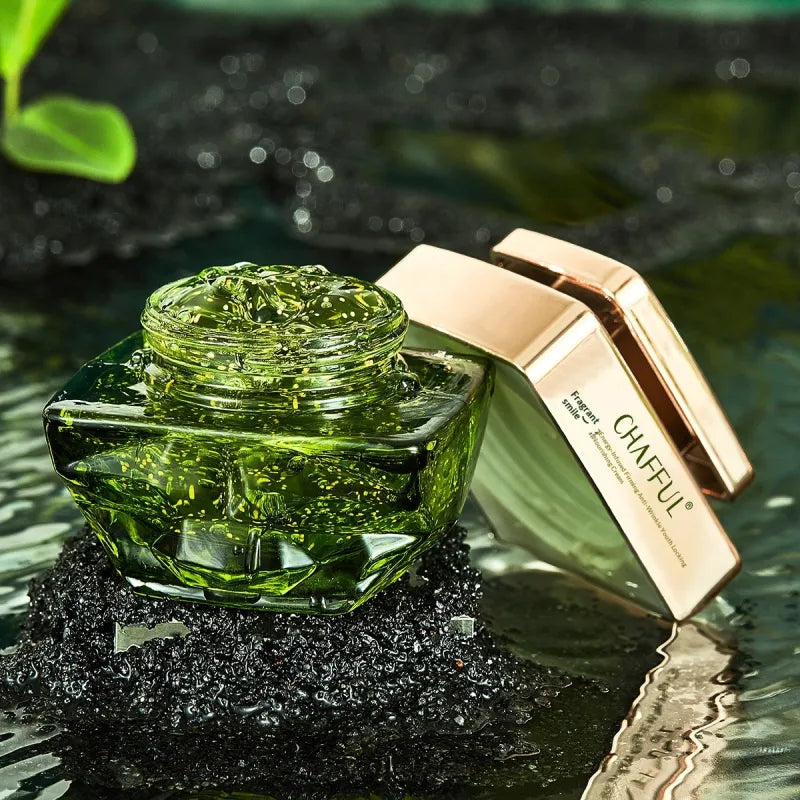 The jar open, showing the green gel and its flecks.