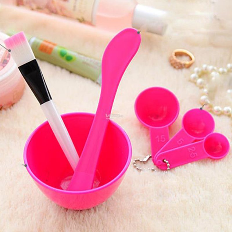 The pink mask bowl set with the brush and stick resting in the bowl